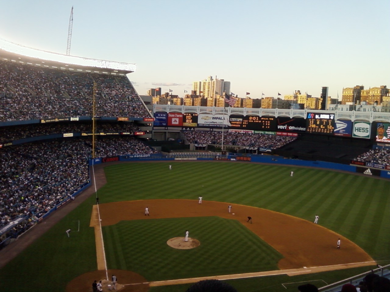 A baseball game at old Yankee Stadium as evening approaches